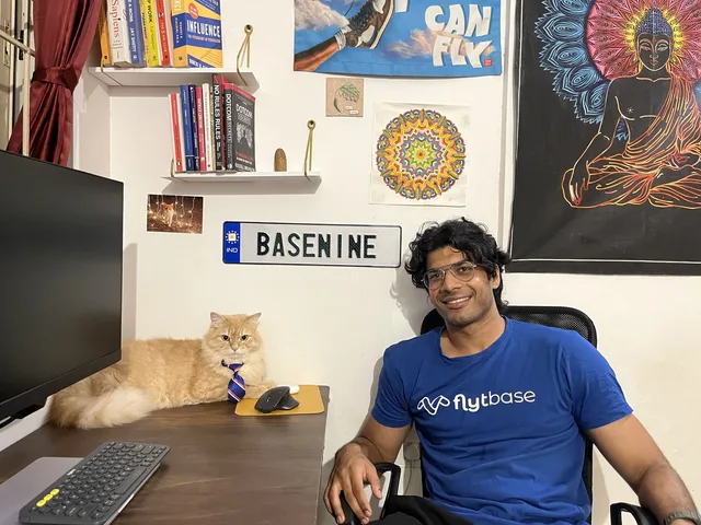 Basil at his desk with his cat